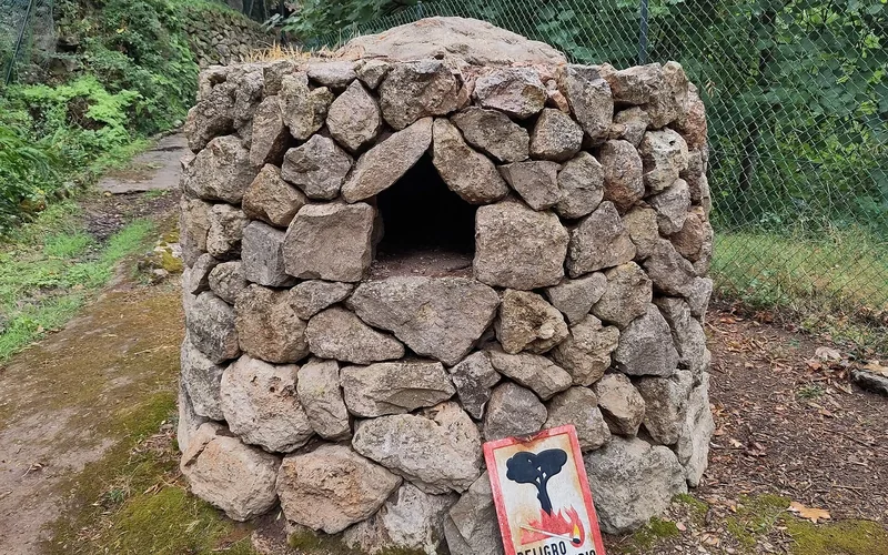 The masonry opening and interior of a traditional bread oven.